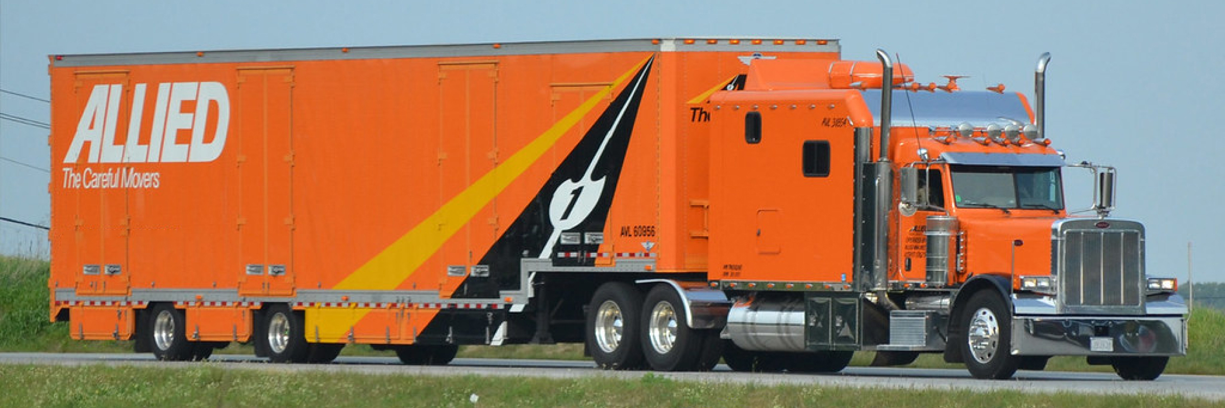 Long-Distance-Moving-from-Grand-Rapids-2 an allied van lines truck drives down a road