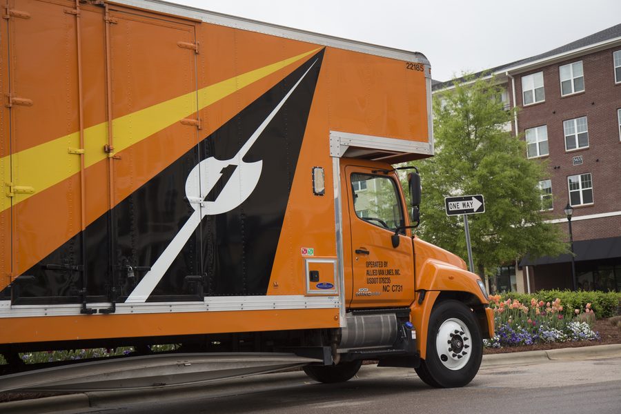 card-local.jpg a side view of a parked allied van lines moving truck