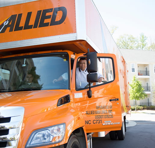 Local Movers for Cleveland and Northeast Ohio (1) an allied van lines driver smiles while getting into his truck